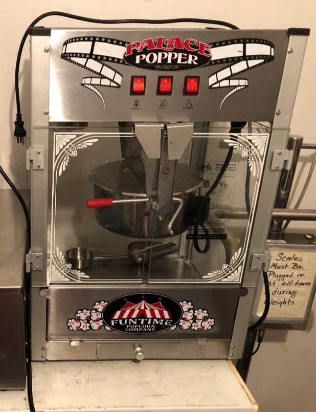 Countertop popcorn machine with warming cabinet